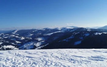 Stock Video Aerial Shot From The Top Of A Snowy Mountain for PC