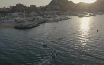Stock Video Aerial Shot Of A Boat Moving Away From A Coast for PC
