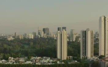 Stock Video Aerial Shot Of A Large City Surrounding A Huge Park for PC