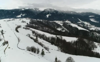 Stock Video Aerial Shot Over Foggy Frozen Mountains for PC