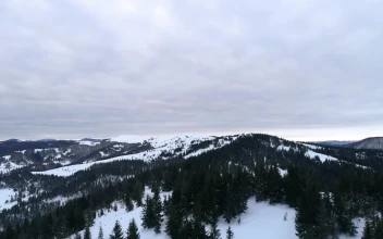 Stock Video Aerial Skyline Of Snowy Mountains With Cloudy Sky for PC