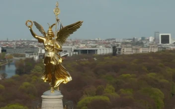 Stock Video Aerial Spinning Shot Of A Statue In A Tower for PC