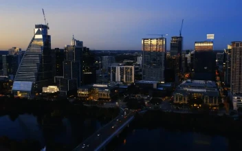 Stock Video Aerial Tour Over A Big City At Dusk for PC