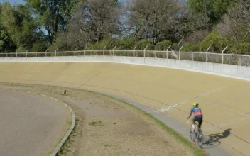 Stock Video Aerial Video Tracking A Cyclist On A Track for PC