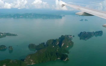Stock Video Aerial View From An Airplane Of Mountains And The Ocean for PC