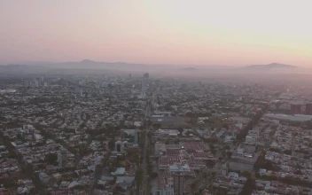 Stock Video Aerial View Of A City During The Sunrise for PC