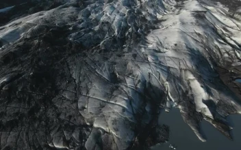Stock Video Aerial View Of A Glacier Leading Into The Ocean for PC
