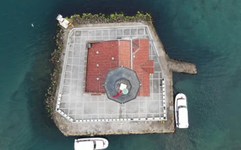 Stock Video Aerial View Of A Lighthouse On A Small Island for PC