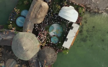 Stock Video Aerial View Of A Small Spring Festival In The Beach for PC