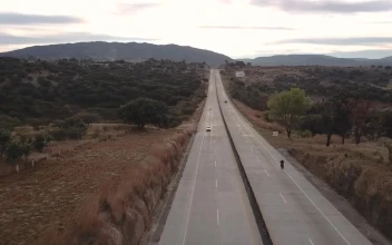 Stock Video Aerial View Of Biker Riding A Motorcycle for PC