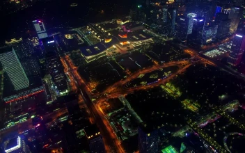 Stock Video Aerial View Of Flashing Buildings In Shenzhen for PC