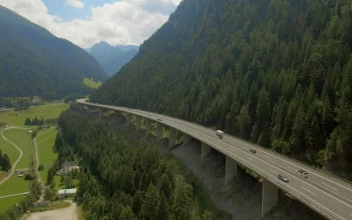 Stock Video Aerial View Of Highway Bridge Along Mountain Ridge for PC