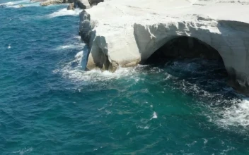 Stock Video Aerial View Of Sarakiniko Lunar Volcanic Beach for PC