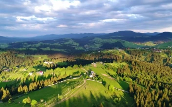 Stock Video Aerial View Of The Countryside In A Cloudy Day for PC