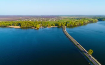 Stock Video Aerial View Of The Dam River With A Road Crossing for PC