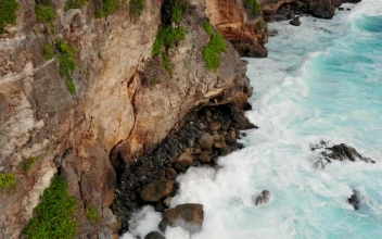 Stock Video Aerial View Of Turquoise Waves Crashing On Cliffs for PC