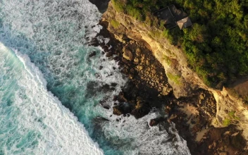 Stock Video Aerial View Of Waves Breaking On Cliffs for PC