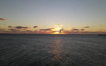 Stock Video Aerial Zoom Out Shot Of The Sea At Sunset for PC