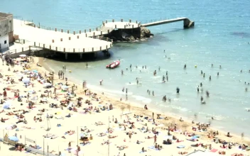 Stock Video Beach Full Of Tourists Next To The Pier For PC