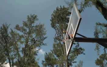 Stock Video Basketball Player Hangs On The Rim For PC