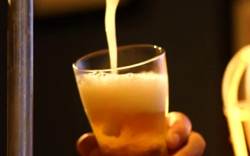Stock Video Bartender Serving Beer From A Tap Looking Down At His For PC