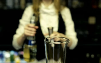 Stock Video Bartender Pouring Shots Into A Mixer For PC