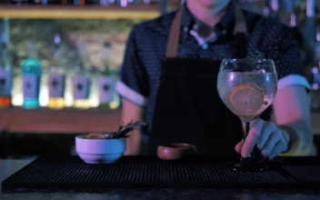 Stock Video Bartender Pouring A Drink For PC