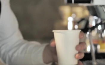 Stock Video Barista Putting The Lid On An Espresso For PC