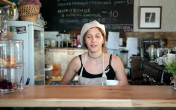 Stock Video Barista Pouring Milk Into A Small Coffee For PC