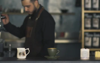 Stock Video Barista Cleaning A Coffee Machine For PC