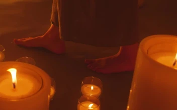 Stock Video Bare Feet Of A Woman Walking Among Burning Candles For PC