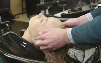 Stock Video Barber Washing Hair In A Sink For PC