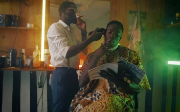 Stock Video Barber And His Client Smoking Cigar During Haircut For PC