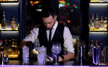 Stock Video Bar Tender Juggling Ice Cubes On A Bar For PC