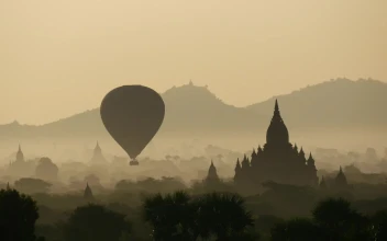 Stock Video Balloon Flying During Sunrise Over Ancient Temples For PC