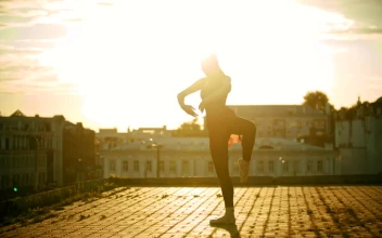 Stock Video Ballet Dancer Doing Poses High Up In A City For PC