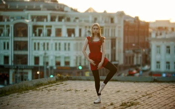 Stock Video Ballet Dancer Doing A Position High Up In A City For PC