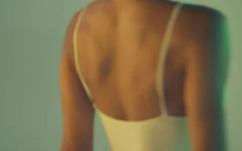 Stock Video Ballerina Dancing Artistically In A White Dress For PC