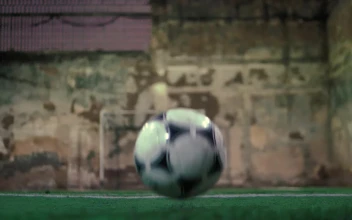 Stock Video Ball Bouncing On The Soccer Field Floor And A Player For PC
