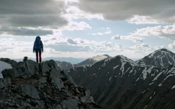 Stock Video Backpacker Raises Arms From Mountain Viewpoint For PC
