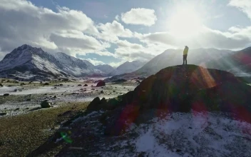Stock Video Backpacker Gazes Over Mountain Landscape From Hill For PC