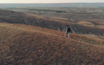 Stock Video Backpacker Hiking In The Hills Aerial Shot For PC