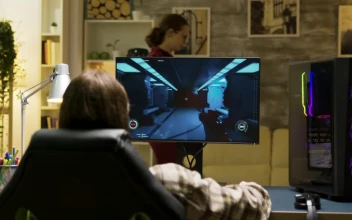 Stock Video Back View Of Man Video Gaming At Home For PC