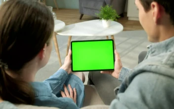 Stock Video Back View Of Couple Holding Green Screen Tablet For PC
