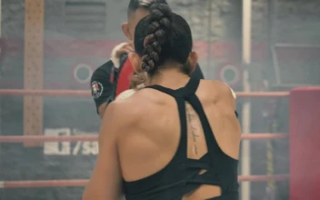 Stock Video Back View Of A Woman Doing Kickboxing With Her Coach For PC