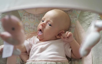 Stock Video Baby Yawning In Their Crib For PC