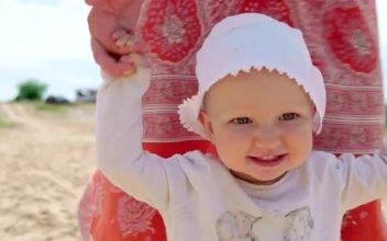 Stock Video Baby Walking With Help From Their Mother For PC
