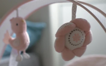 Stock Video Baby Toys Hanging Over A Bed For PC
