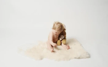 Stock Video Baby Girl Playing With Plushie In The Studio For PC