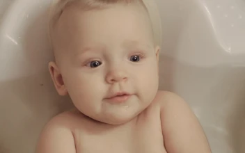 Stock Video Baby Girl Chewing A Bath Toy For PC